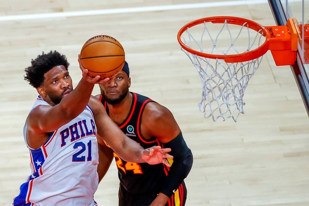 Joel Embiid (L)