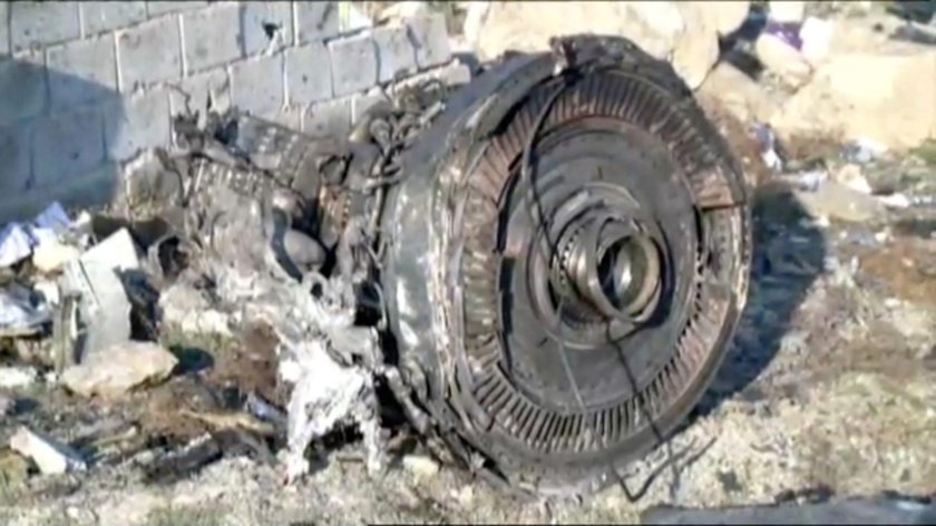 Emergency workers work near the wreckage of Ukraine International Airlines flight PS752, a Boeing 73