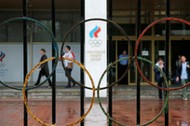 People walk out of the Russian Olympic Committee headquarters in Moscow