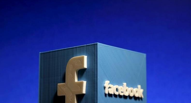 A 3D plastic representation of the Facebook logo is seen in this illustration in Zenica, Bosnia and Herzegovina, May 13, 2015.   REUTERS/Dado Ruvic