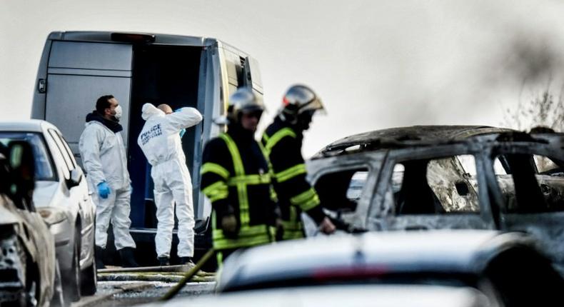 Forensics officers work at the site where thieves held up a van and stole 70 kilograms of gold near Lyon, France, on December 12, 2016