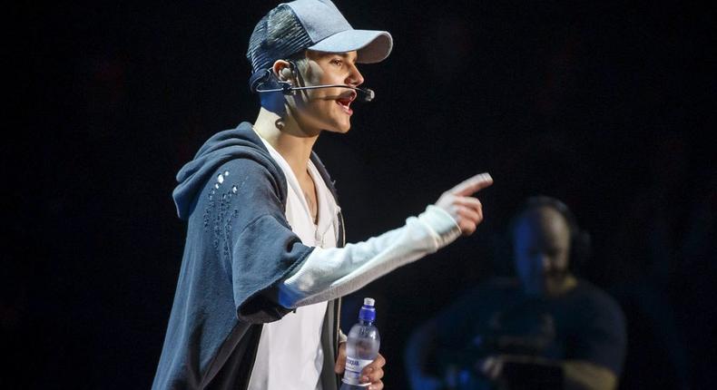 Singer Justin Bieber stands on stage during a concert in Oslo October 29, 2015