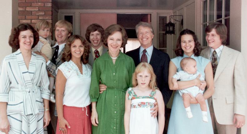 A portrait of President Jimmy Carter and his extended family. Left to right: his daughter-in-law Judy Carter, grandson Jason James Carter; son Jack Carter, daughter in law Annette Carter, son Jeff Carter, wife Rosalynn Carter, daughter Amy Carter, Jimmy Carter, daughter-in-law Caron Griffin Carter holding James Earl Carter IV, and son Chip Carter.CORBIS/Corbis via Getty Images
