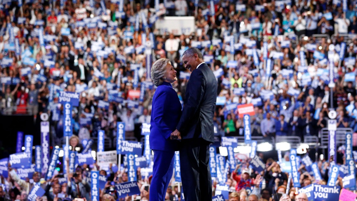 Clinton joins Obama onstage after his remarks on the third night of the Democratic National Conventi