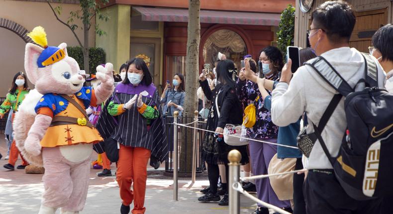 A staff member dressed as LinaBell waves to visitors at Shanghai Disney Resort.Xinhua/Getty Images