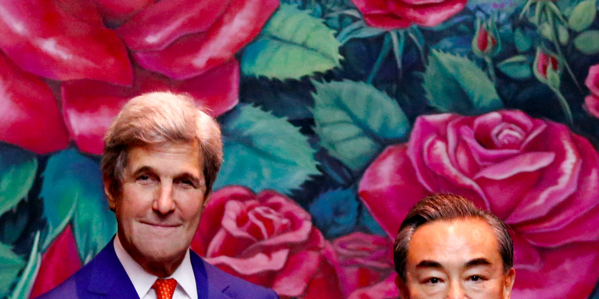 US Secretary of State John Kerry (L) greets China's Foreign Minister Wang Yi during a bilateral meeting at the sidelines of the ASEAN foreign ministers meeting in Vientiane, Laos July 25, 2016.