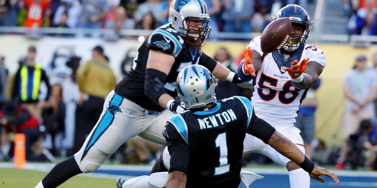 Denver Broncos' Miller strips the ball from Carolina Panthers' quarterback Newton on a sack leading to a Denver recovery in the end zone for a touchdown during Super Bowl 50.