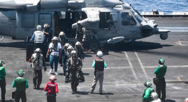 Sailors assigned to the Dwight D. Eisenhower Carrier Strike Group airlifted the crew of the Tutor to safety.US Navy