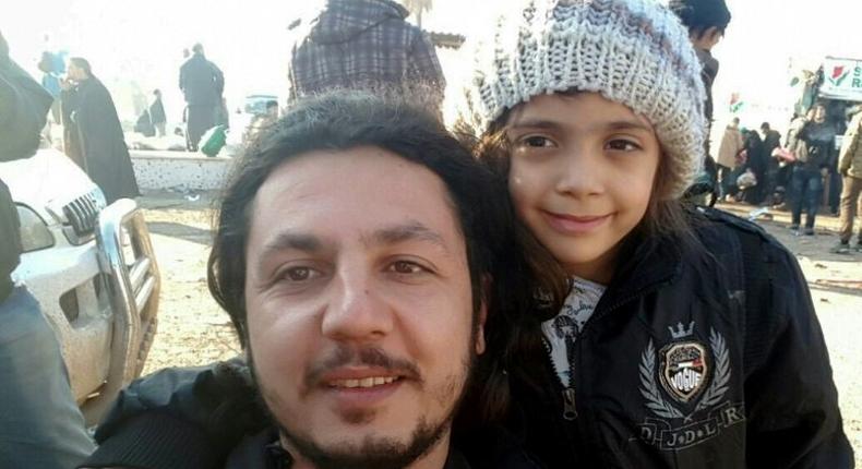 A Humanitarian Relief Foundation worker takes a selfie with seven-year-old Bana al-Abed in Rashidin district in Syria after she was evacuated from Aleppo on December 19, 2016