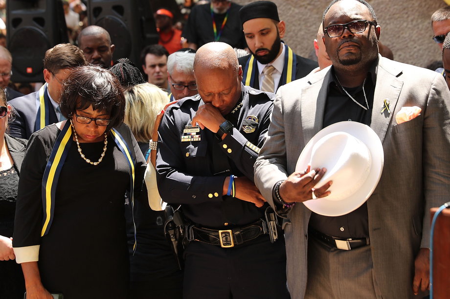Dallas Police Chief David Brown pauses at a prayer vigil following the deaths of five police officers during a Black Lives Matter march on July 8.