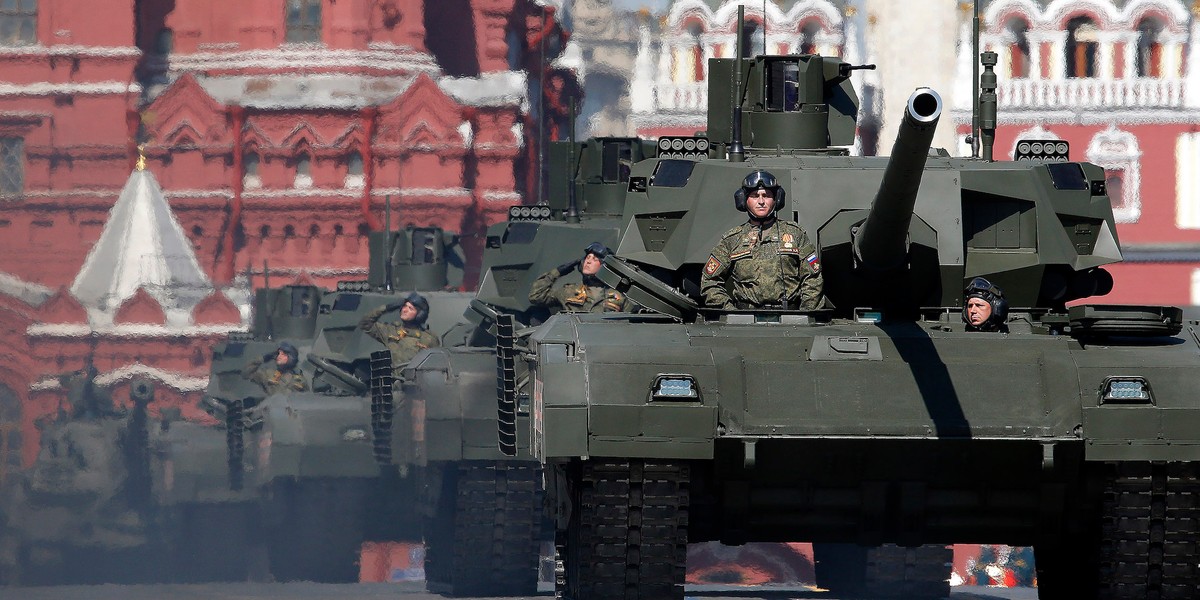 Russian servicemen stand atop T-14 tanks with the Armata Universal Combat Platform during the Victory Day parade, marking the 71st anniversary of the victory over Nazi Germany in World War Two, at Red Square in Moscow, Russia, May 9, 2016.