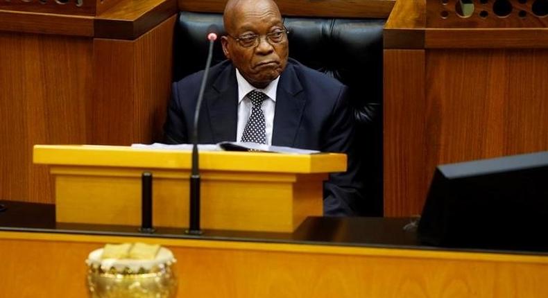 President Jacob Zuma looks on as members of Julius Malema's Economic Freedom Fighters (EFF) party raise objections during Zuma's question and answer session in Parliament in Cape Town, South Africa, September 13, 2016. 