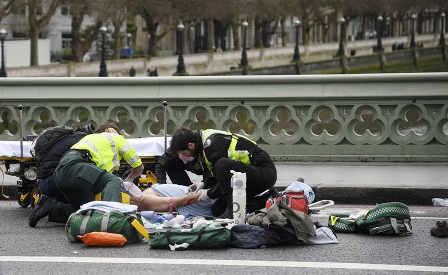 Paramedics treat an inured person after an incident on Westminster Bridge in London