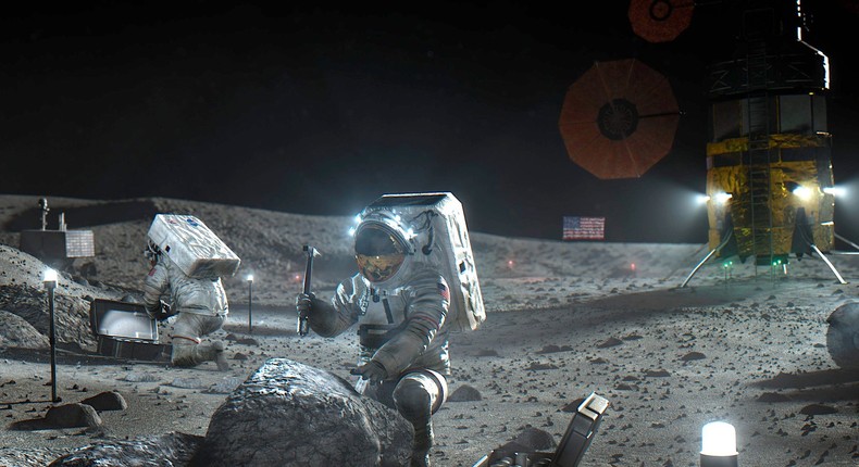 An artists illustration depicts Artemis astronauts on the moon.
