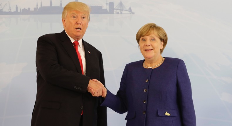 President Donald Trump and German Chancellor Angela Merkel shake hands in Hamburg, Germany.