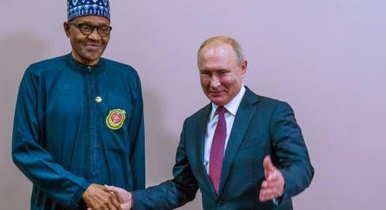 President Buhari shakes President Putin during the Russia-Africa summit (Channels TV)