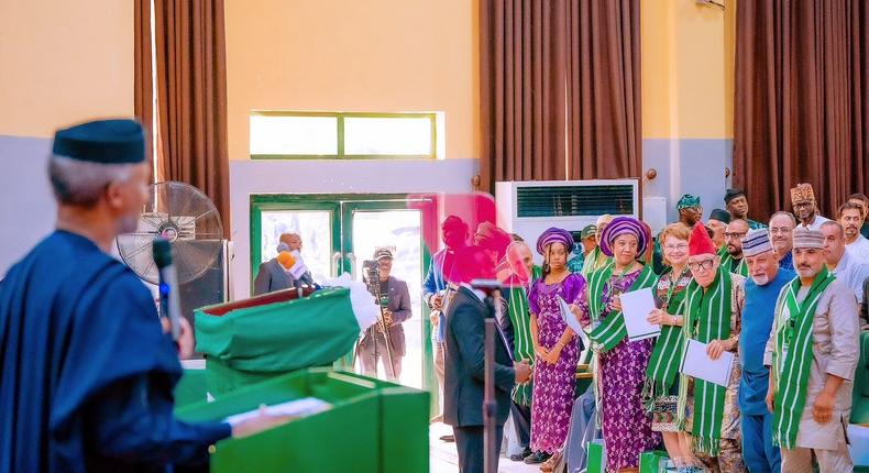 Vice President, Yemi Osinbajo addressing some foreigners who just bagged Nigerian citizenship. [Facebook:BuhariSallau]