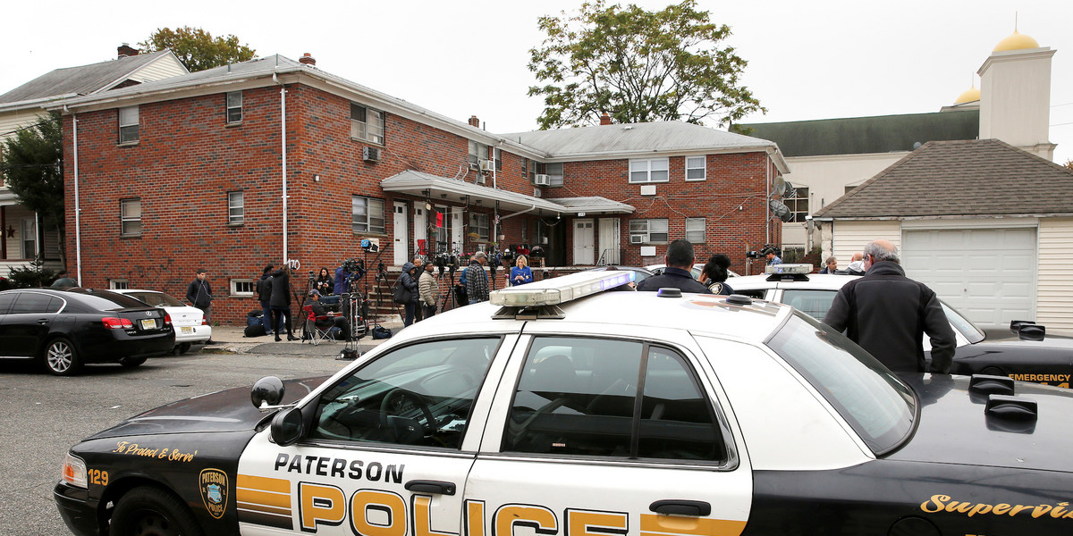 Police are pictured in front of what according to local media is the apartment of Sayfullo Saipov, the suspect in the New York City truck attack in Paterson, New Jersey on November 1, 2017.