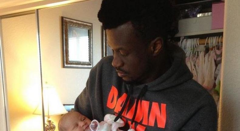 Peter Okoye holding his daughter Aliona three years ago