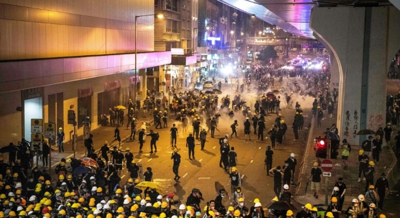 Tear gas filled Hong Kong's commercial district on Sunday