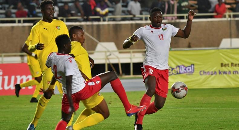 Peniel Mlapa (L) and Kodjo Fo-Doh Laba of Togo and Victor Wanyama (R) and Stanley Okumu of Kenya seek possession during a drawn Cup of Nations qualifier