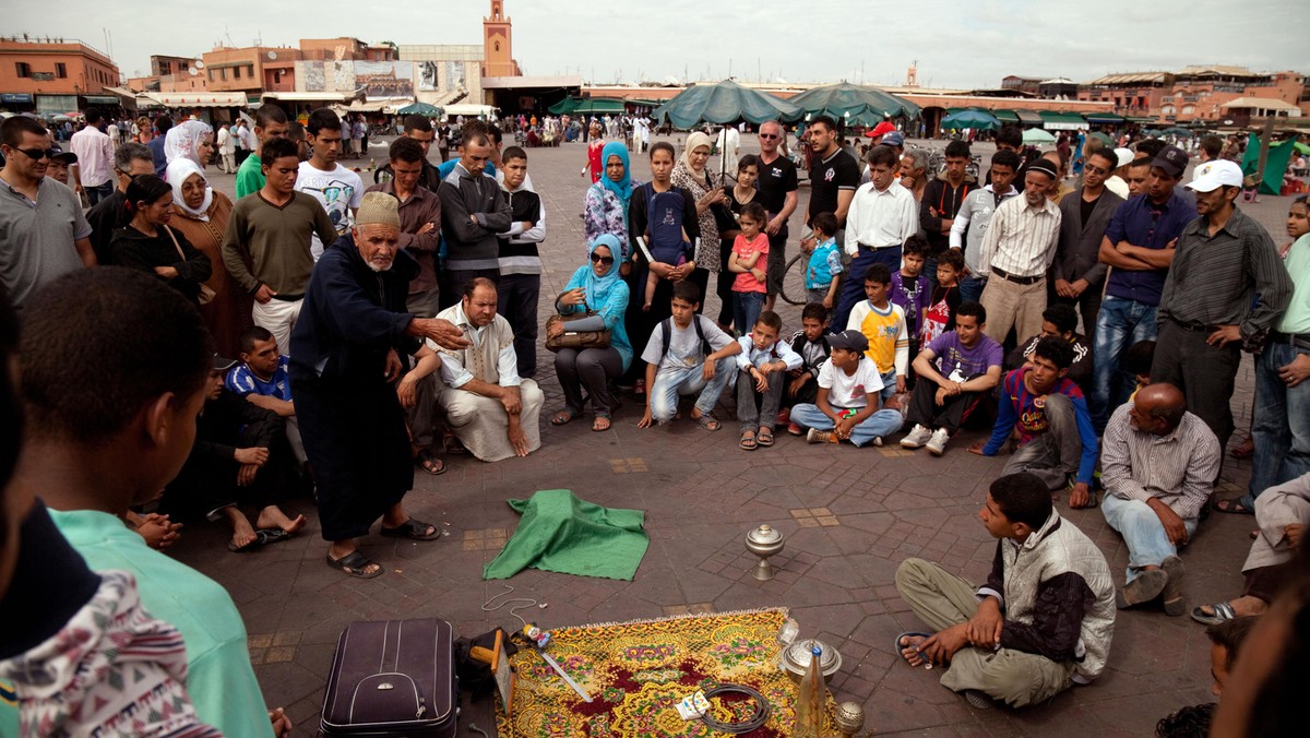 Arab Storyteller and crowd, Djemma el Fna Square Marrakech Morocco Africa