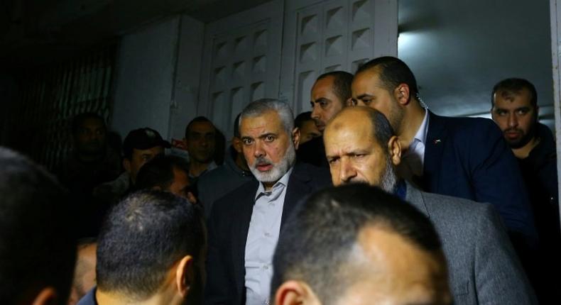 Senior Hamas leader Ismail Haniya (C) leaves a hospital morgue in Gaza City on March 24, 2017 after gunmen in the Gaza Strip shot dead a Hamas official who was freed by Israel in a 2011 prisoner swap