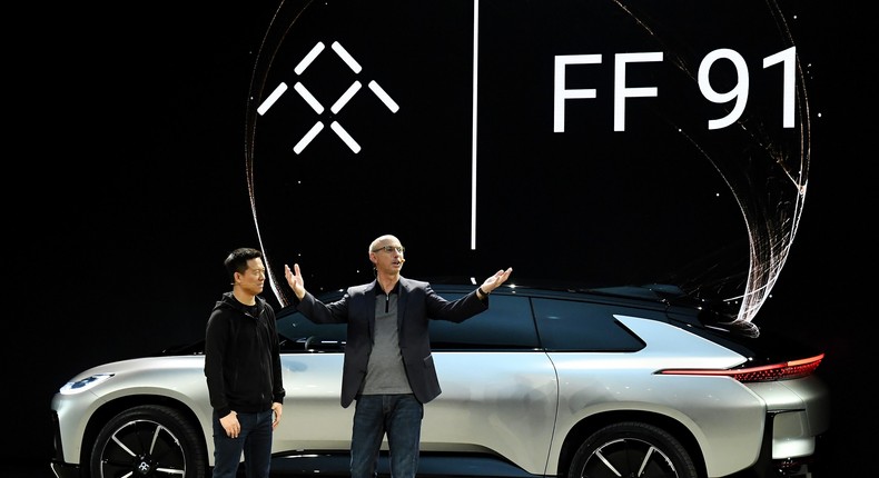 LeEco CEO YT Jia, left, and Faraday Future SVP Nick Sampson unveil Faraday Future's FF 91 prototype at CES 2017 in Las Vegas.