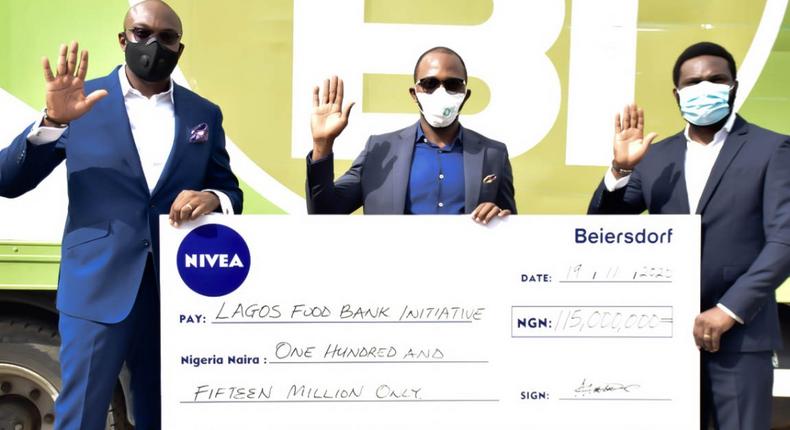 From Left: Country Manager, Beiersdorf Nigeria, Godwin Harrison; Founder, Lagos Food Bank Initiative (LFBI) Michael Sunbola; and Faizal Kayode, Beiersdorf Nigeria Shopper and Customer Marketing Manager at the presentation of Beiersdorf’s N115m donation to LFBI to provide meals to over 350,000 Nigerians to mitigate hunger caused by COVID-19