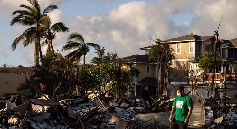 A Mercy Worldwide volunteer makes damage assessment of charred apartment complex in the aftermath of a wildfire in Lahaina, western Maui, Hawaii on August 12, 2023.YUKI IWAMURA/AFP via Getty Images