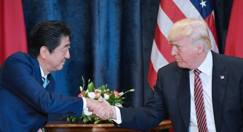 US President Donald Trump shakes hands with Japanese Prime Minister Shinzo Abe during a meeting before the G7 summit in Taormina, Italy, on May 26, 2017