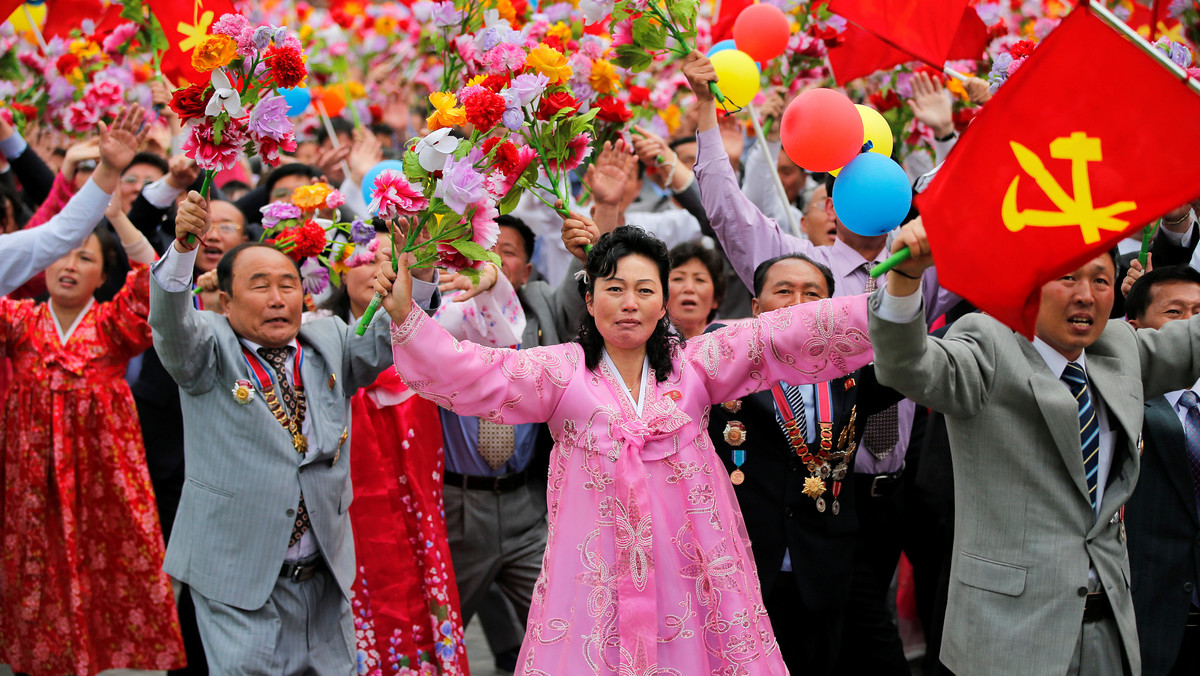 People react as they see North Korean leader Kim Jong Un during a mass rally and parade in Pyongyang