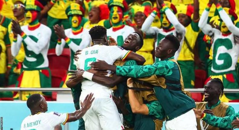 Senegal celebrating after becoming one of only two African nations to advance to the round of 16 of the World Cup in Qatar