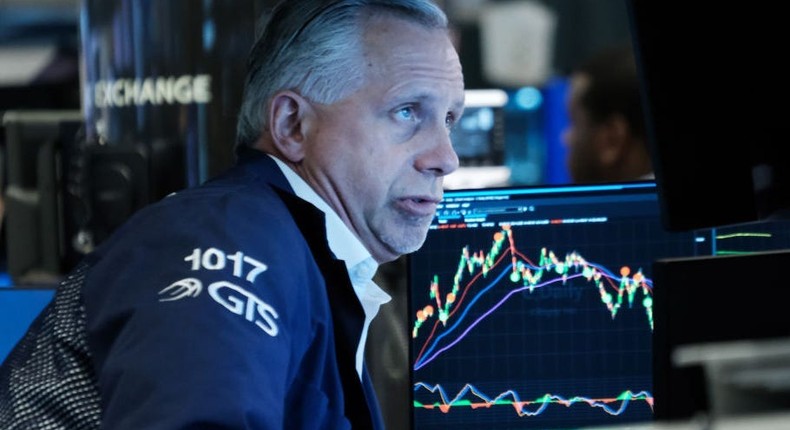 Traders work on the floor of the New York Stock Exchange.