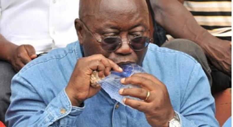 President Akufo-Addo drinking sachet water.