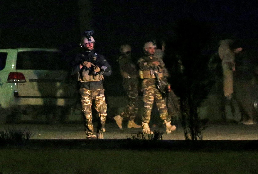 Afghan security force keep watch near the site of an attack on the Intercontinental Hotel in Kabul