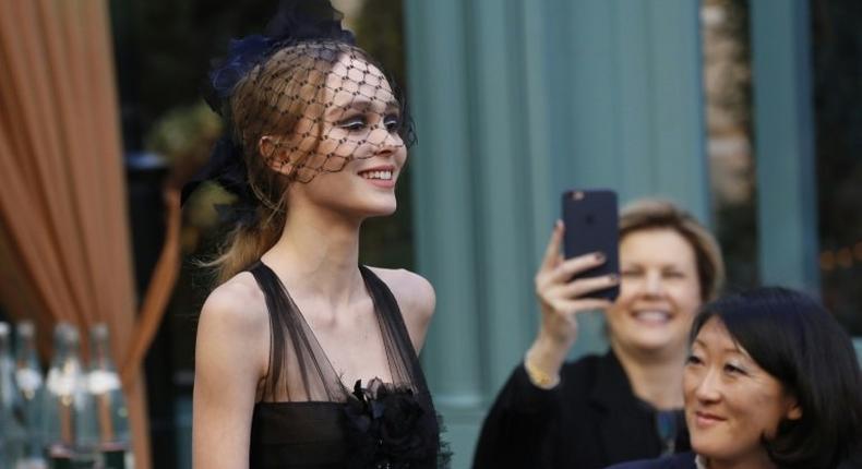 French-American actress and model Lily-Rose Depp presents a creation for Chanel, during the 13th Métiers d'Art show in Paris