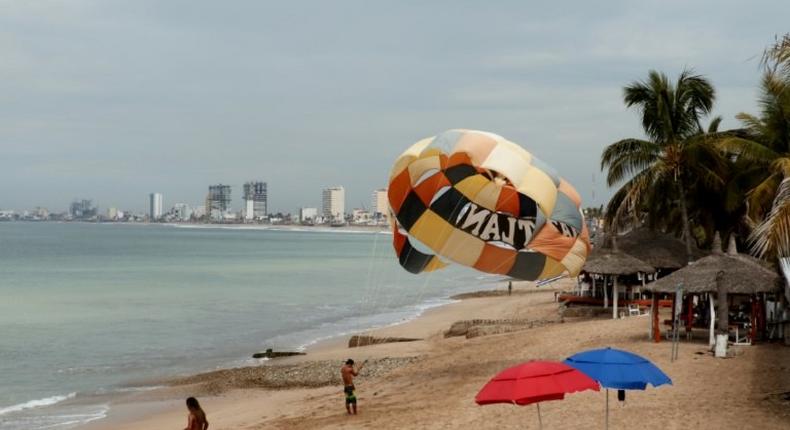 People enjoy the beach in Mazatlan, Mexico on October 21, 2018, ahead of an expected hit from Hurricane Willa