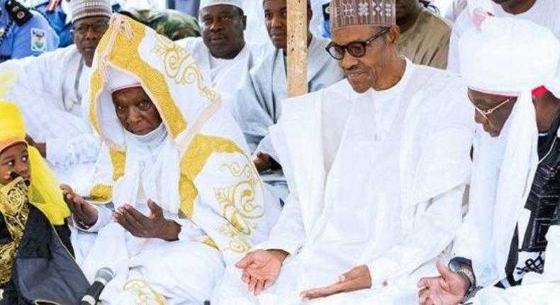 President Buhari praying with other religious leaders