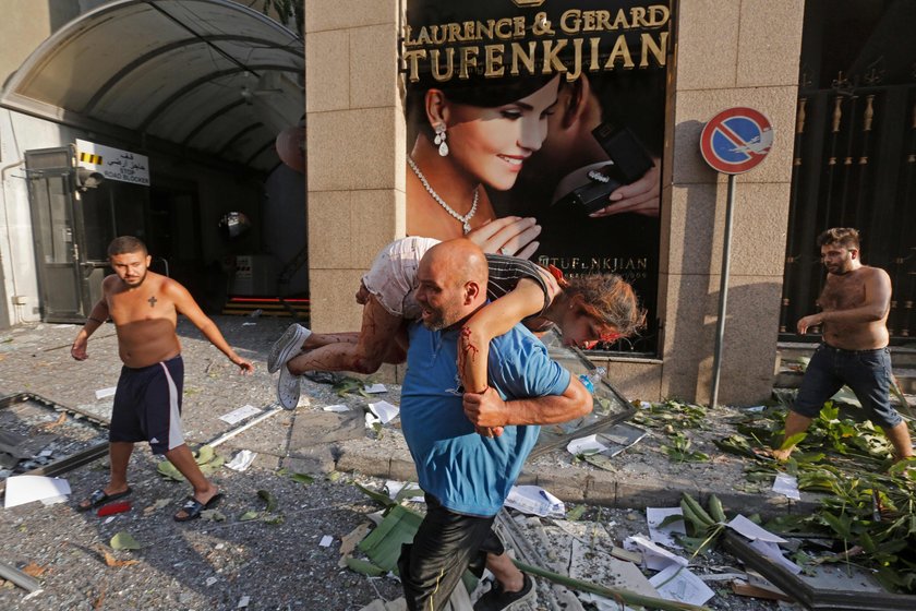 Damaged vehicle and buildings are pictured near the site of Tuesday's blast in Beirut's port area