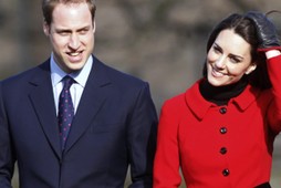 Britain's Prince William and his fiancee Kate Middleton smile during a visit to St. Andrews Universi