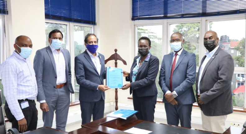 Ugandan government official and Lycamobile officials in a shot