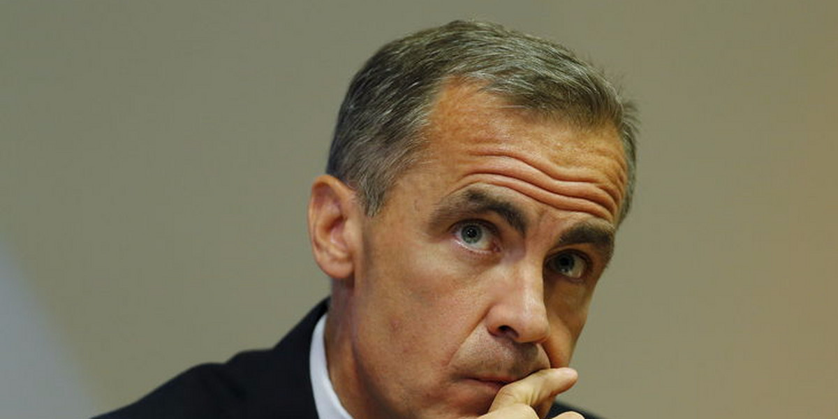 File photo of Bank of England Governor Mark Carney listening to a journalist's question during the bank's quarterly inflation report news conference at the Bank of England in London