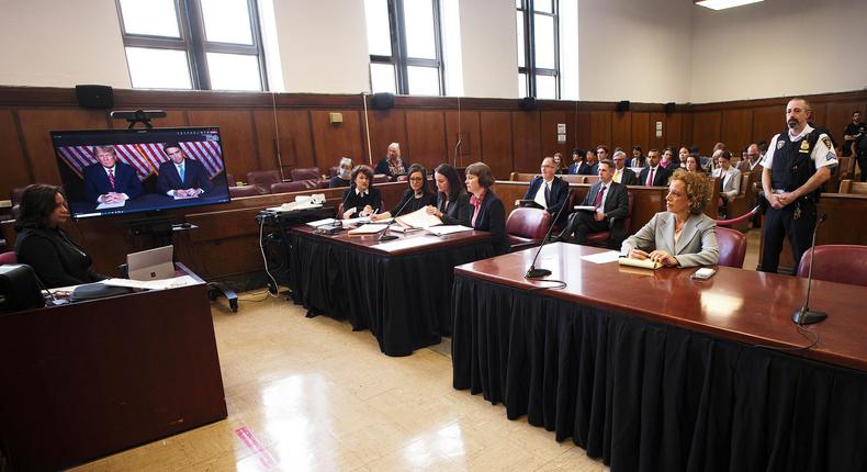 Former president Donald Trump, left on screen, and his attorney, Todd Blanche, right on screen, appear by video, as his other attorney Susan Necheles, right, looks on, before a hearing begins in Manhattan criminal court.AP Photo/Curtis Means via Pool