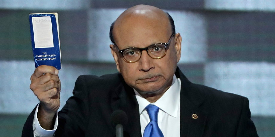 Khizr Khan, father of a deceased Muslim US Soldier, holds up a booklet of the US Constitution as he delivers remarks on the fourth day of the Democratic National Convention at the Wells Fargo Center in Philadelphia.