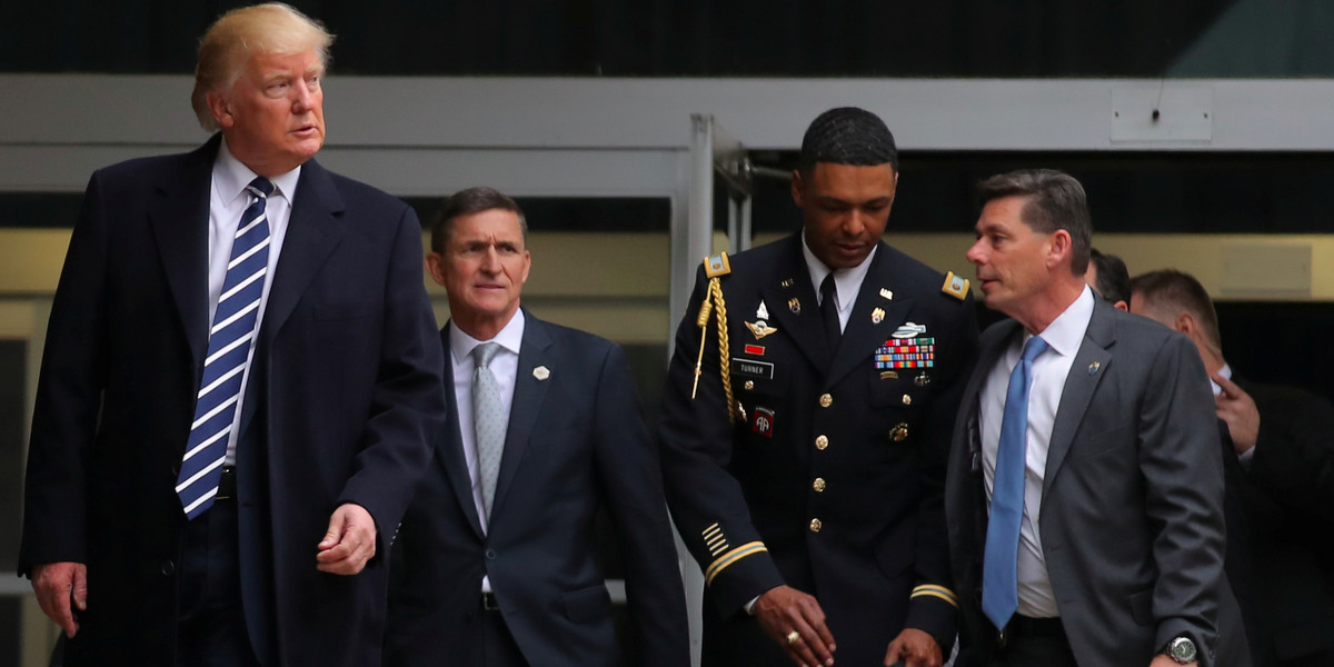 Trump leaving the CIA headquarters with Michael Flynn after delivering remarks during a visit in Langley, Virginia, on January 21.