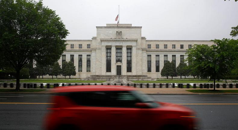 In this May 22, 2020, file photo, a car drives past the Federal Reserve building in Washington.Patrick Semansky/AP Photo