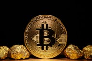 Golden Bitcoin Coin and mound of gold on black background