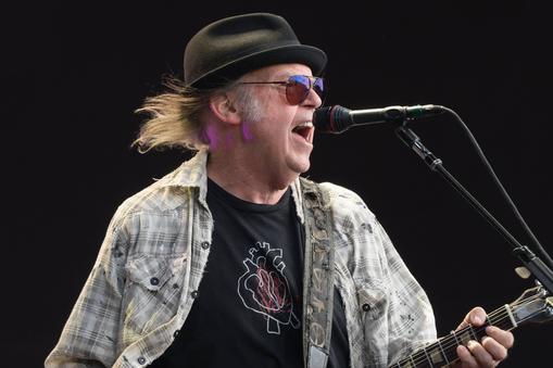 Neil Young performing live on stage in Hyde Park in London