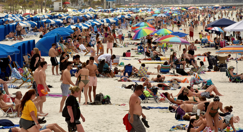 Locals and spring breakers flock to Clearwater Beach in Florida. While some counties like Miami-Dade and Broward have closed down beaches to curb the spread of the coronavirus, others remain open. Florida has not yet issued a state-wide stay-at-home order.